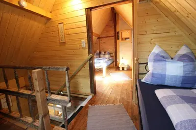 Ein Bett oder Betten in einem Zimmer der Unterkunft Ferienhaus Anno Dazumal, wie zu Großmutters Zeiten