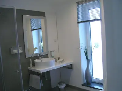 Ein Badezimmer in der Unterkunft Hotel Ambiente