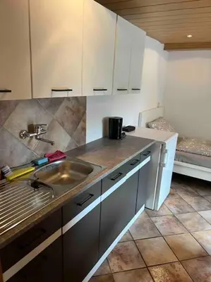 Küche/Küchenzeile in der Unterkunft Gemütliche 1-Zimmer-Wohnung