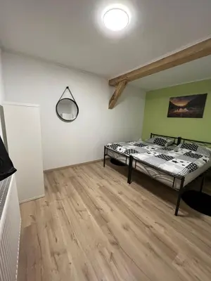 Ein Bett oder Betten in einem Zimmer der Unterkunft Ferienwohnung Pfaffensteinblick
