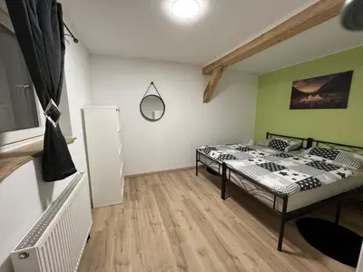 Ein Bett oder Betten in einem Zimmer der Unterkunft Ferienwohnung Pfaffensteinblick