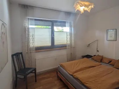 Ein Bett oder Betten in einem Zimmer der Unterkunft Wohnung mit Terrasse und eigenem Parkplatz