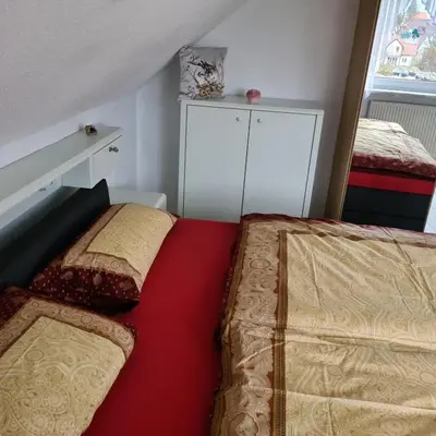 Ein Bett oder Betten in einem Zimmer der Unterkunft Ferienwohnung Sahrmann