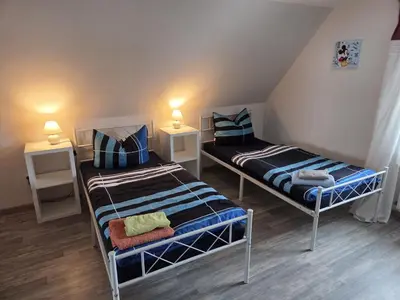 Ein Bett oder Betten in einem Zimmer der Unterkunft Ferienwohnung, Urlaub im Frankenwald