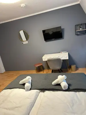 Ein Bett oder Betten in einem Zimmer der Unterkunft Ferienwohnung BX