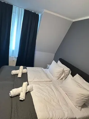 Ein Bett oder Betten in einem Zimmer der Unterkunft Ferienwohnung BX