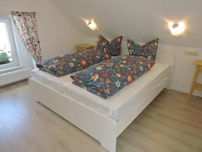 Ein Bett oder Betten in einem Zimmer der Unterkunft Ferienwohnungen Haus Sebastian