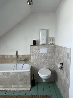 Ein Badezimmer in der Unterkunft Grüne Villa