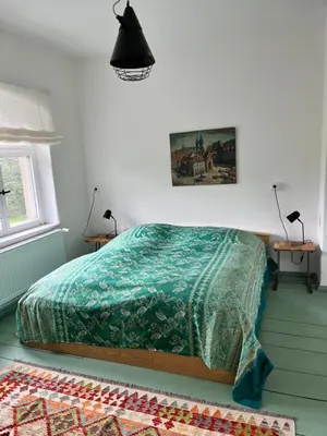 Ein Bett oder Betten in einem Zimmer der Unterkunft Grüne Villa