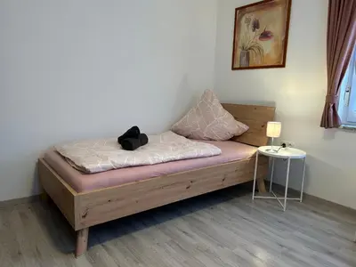 Ein Bett oder Betten in einem Zimmer der Unterkunft Gästehaus Trockau