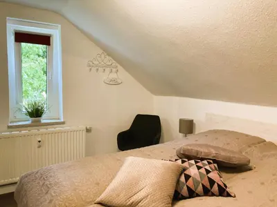 Ein Bett oder Betten in einem Zimmer der Unterkunft Ferienwohnung Schickolores