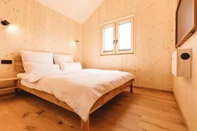 Ein Bett oder Betten in einem Zimmer der Unterkunft NaturResort Steinwald