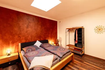Ein Bett oder Betten in einem Zimmer der Unterkunft Großzügiges Apartment im Loft-Stil