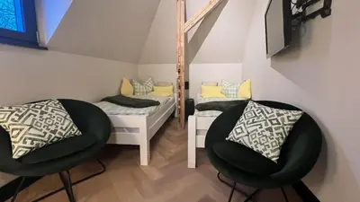 Ein Bett oder Betten in einem Zimmer der Unterkunft außergewöhnliche Ferienwohnung Stadtvilla Plauen