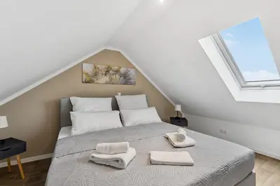 Ein Bett oder Betten in einem Zimmer der Unterkunft EasyApartments stilvoll zentral Balkon Hauptbahnhof NETFLIX 130m2