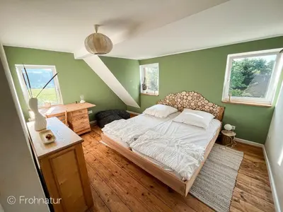 Ein Bett oder Betten in einem Zimmer der Unterkunft Tolles Ferienhaus Frohnatur mit Sauna in ruhiger Lage