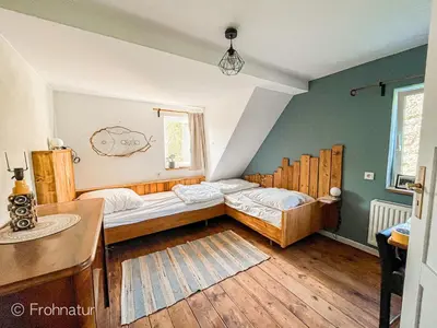 Ein Bett oder Betten in einem Zimmer der Unterkunft Tolles Ferienhaus Frohnatur mit Sauna in ruhiger Lage
