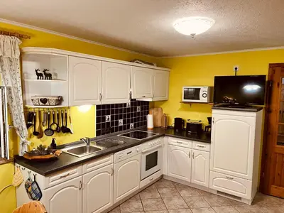 Küche/Küchenzeile in der Unterkunft Ferienhaus Ingrid gemütliches Cottage im Grünen