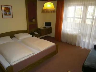 Ein Bett oder Betten in einem Zimmer der Unterkunft Pension Drei Linden
