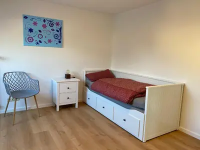 Ein Bett oder Betten in einem Zimmer der Unterkunft Ferienwohnung Blumenau