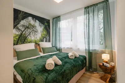 Ein Bett oder Betten in einem Zimmer der Unterkunft Modernes 2-Zimmer Themen-Apartment im Zentrum