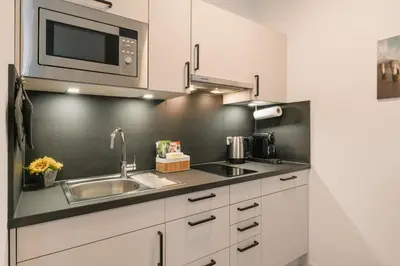 Küche/Küchenzeile in der Unterkunft Modernes 2-Zimmer Themen-Apartment im Zentrum