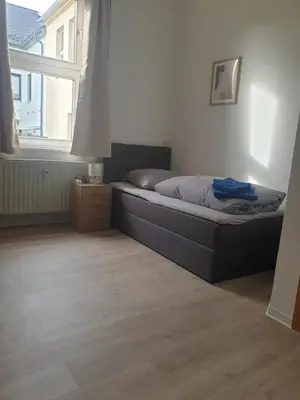 Ein Bett oder Betten in einem Zimmer der Unterkunft Zur Altstadt