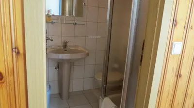 Ein Badezimmer in der Unterkunft Pension Waldhaus