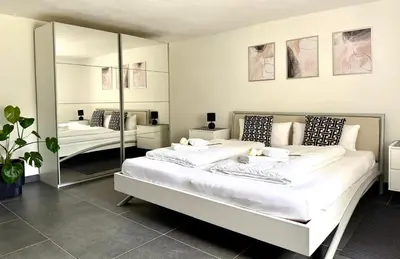 Ein Bett oder Betten in einem Zimmer der Unterkunft Stilvolles Designappartment mit Terasse & Garten im idylischem Bindlach