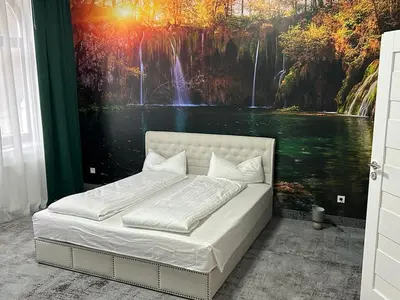 Ein Bett oder Betten in einem Zimmer der Unterkunft Weißes Haus