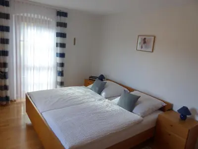 Ein Bett oder Betten in einem Zimmer der Unterkunft Ferienwohnungen Reitinger