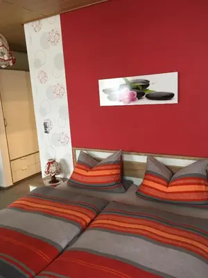 Ein Bett oder Betten in einem Zimmer der Unterkunft Pension Haus Wanninger