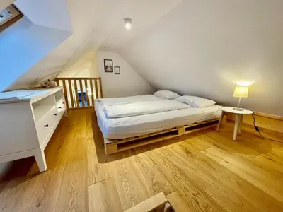 Ein Bett oder Betten in einem Zimmer der Unterkunft Destino in der ehemaligen Waage der Roomerie