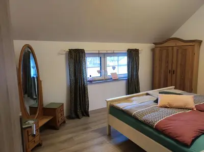 Ein Bett oder Betten in einem Zimmer der Unterkunft Ferienwohnung zum Getreidelager