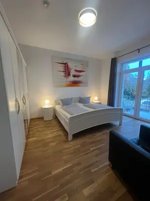 Ein Bett oder Betten in einem Zimmer der Unterkunft Cooles City-Appartment - Balkon
