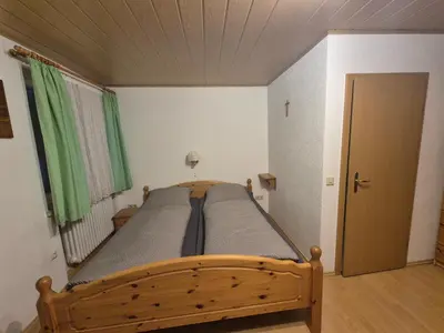 Ein Bett oder Betten in einem Zimmer der Unterkunft Zum Bergbauern