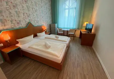 Ein Bett oder Betten in einem Zimmer der Unterkunft Rathaushotel