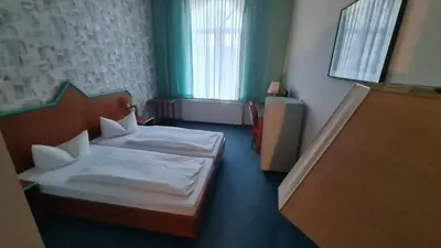 Ein Bett oder Betten in einem Zimmer der Unterkunft Rathaushotel