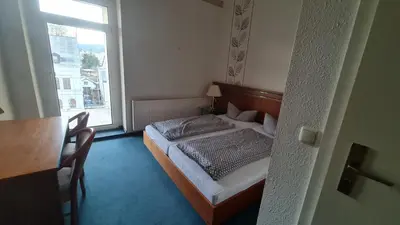 Ein Bett oder Betten in einem Zimmer der Unterkunft Rathaushotel