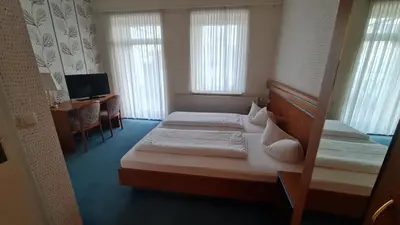 Ein Bett oder Betten in einem Zimmer der Unterkunft Rathaushotel
