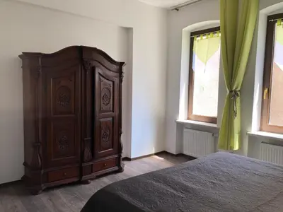 Ein Bett oder Betten in einem Zimmer der Unterkunft Ferienwohnung am Markt