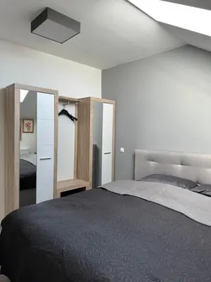 Ein Bett oder Betten in einem Zimmer der Unterkunft Zwillinge Ferienwohnung am Markt