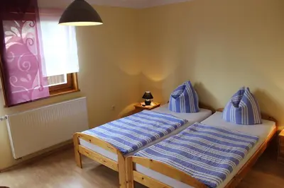 Ein Bett oder Betten in einem Zimmer der Unterkunft Gästehaus zum Prinzenfelsen