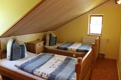 Ein Bett oder Betten in einem Zimmer der Unterkunft Gästehaus zum Prinzenfelsen