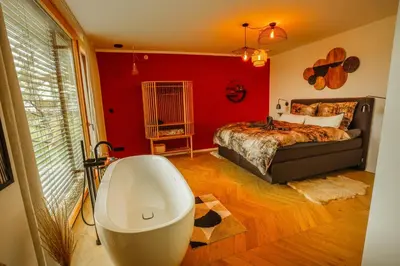 Ein Bett oder Betten in einem Zimmer der Unterkunft Der Schwarzbau - Luxus Ferienhaus und Ferienwohnung