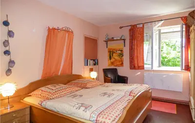 Ein Bett oder Betten in einem Zimmer der Unterkunft Ferienhaus Alex