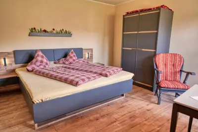 Ein Bett oder Betten in einem Zimmer der Unterkunft Gästehaus Riedl