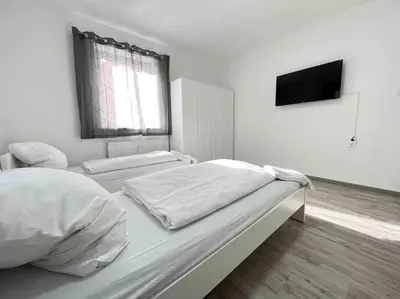 Ein Bett oder Betten in einem Zimmer der Unterkunft SAD104 - Moderne Monteurwohnung/Übergangswohnung