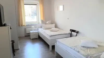 Ein Bett oder Betten in einem Zimmer der Unterkunft Ferienwohnung Oberschieda