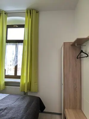 Ein Bett oder Betten in einem Zimmer der Unterkunft Kleinzimmer am Markt